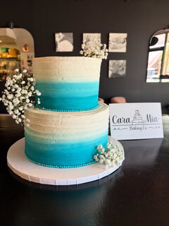 blue ombre tiered wedding cake baby breath